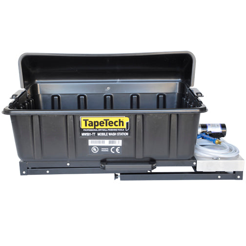 Close-up of black TapeTech wash basin, hose and sprayer on steel table