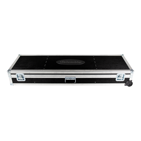 Top view of a closed Columbia Roadcase with a white Columbia logo on the lid, gunmetal grey trim and latches, and black rolling wheels